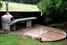 Wood-fired pizza oven, polished concrete bench-top, outdoor kitchen, landscaping